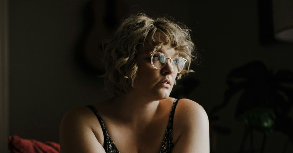 Woman-looking-out-window-moody.jpg